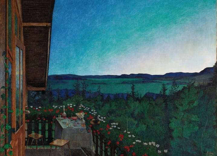Wooden veranda overlooking a fjord at deep blue twilight, table set with glasses and roses along the railing