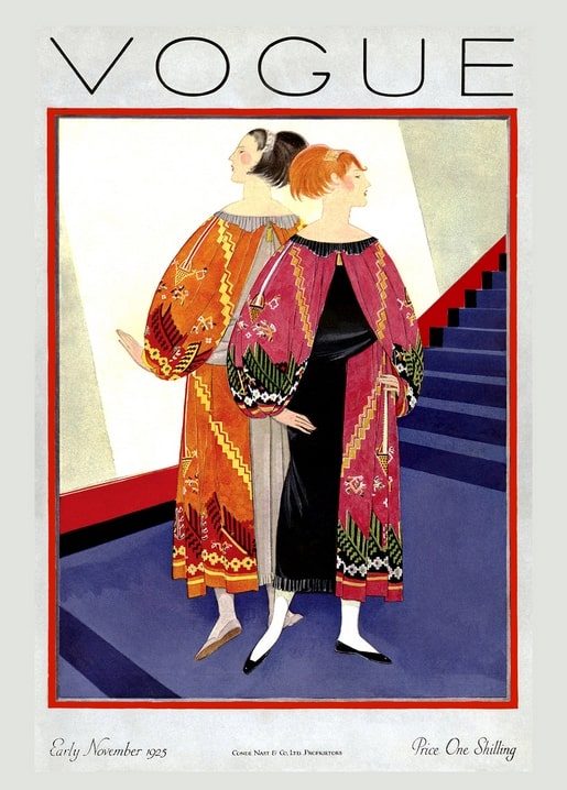 Vogue cover, November 1925: two women in embroidered orange and pink coats on a staircase