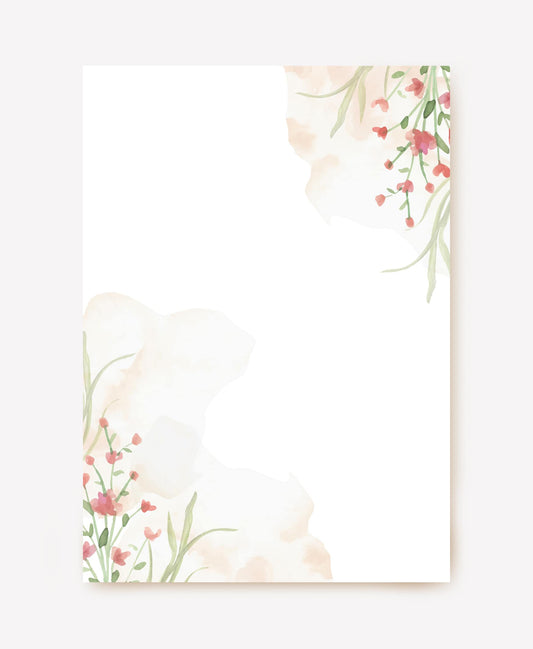 Blank letter paper with watercolor pink and peach flowers in two corners
