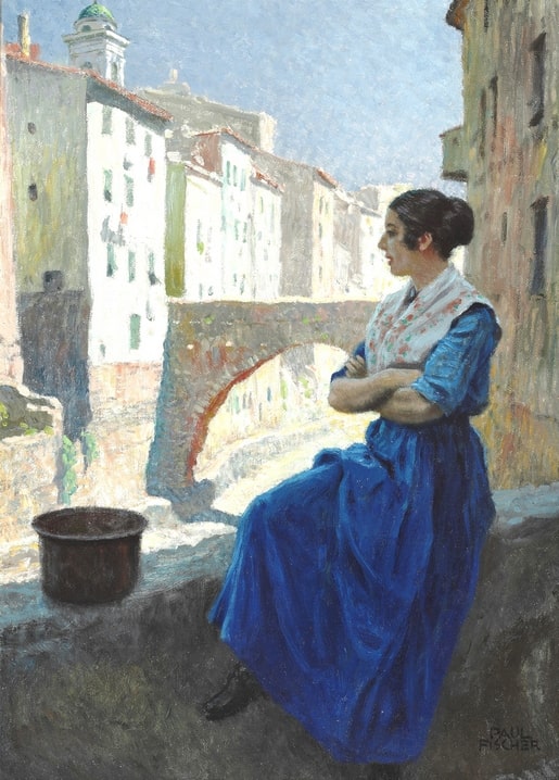 Woman in a blue dress leaning against a stone wall by a canal bridge in a sunlit town