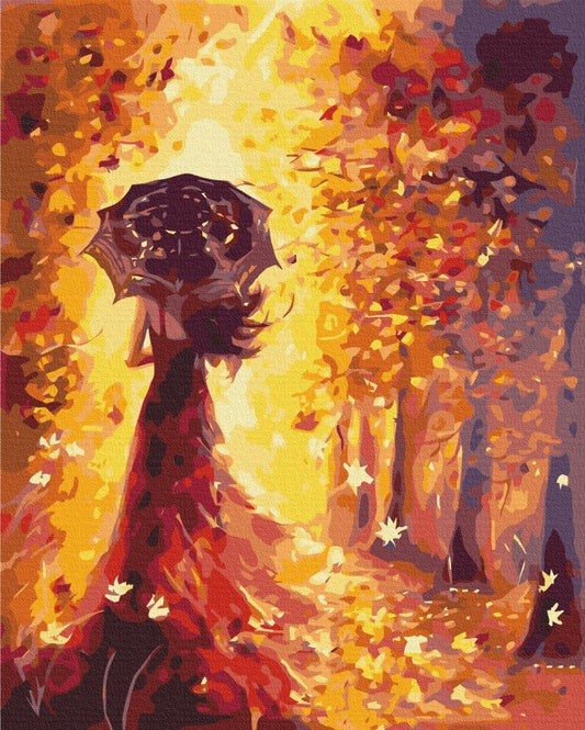 Frau in rotem Kleid mit Sonnenschirm im goldenen Herbstwald