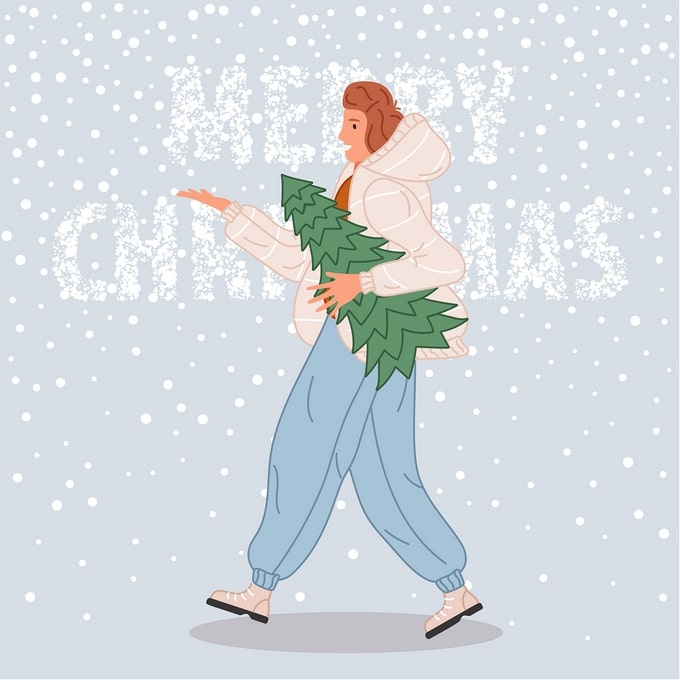 Woman in a white puffer coat carrying a small pine tree through falling snow