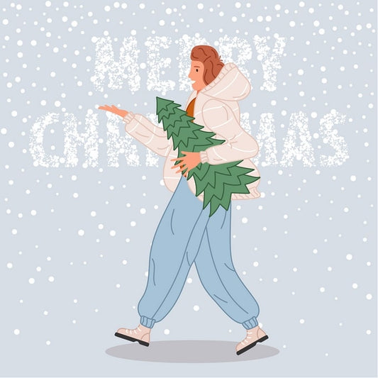 Woman in a white puffer coat carrying a small pine tree through falling snow