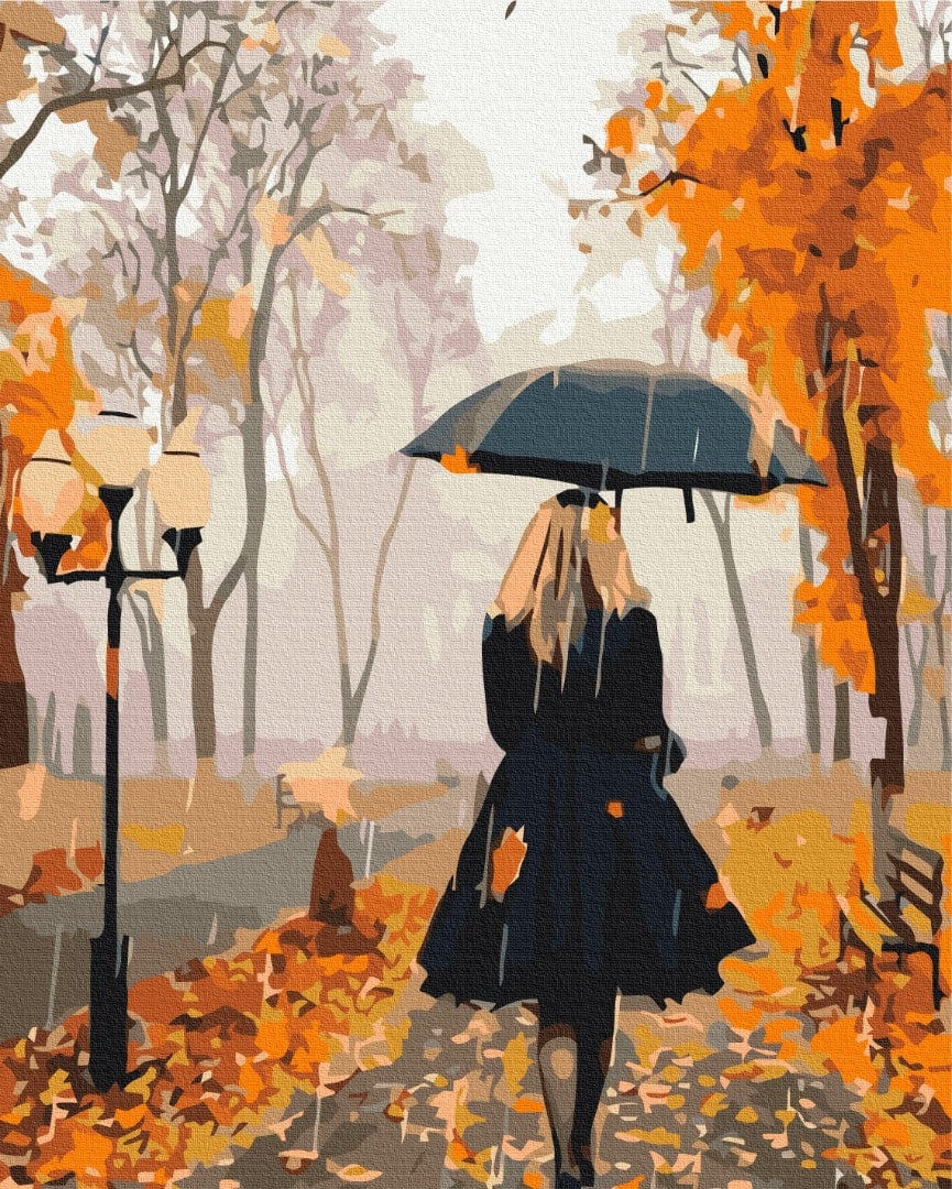 Malen-nach-Zahlen-Motiv einer Frau mit Regenschirm im herbstlichen Park im Regen