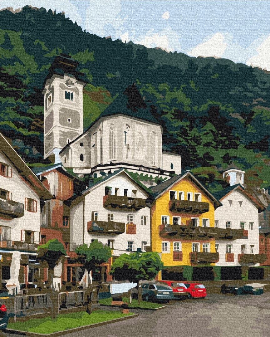 Alpine village paint-by-numbers: white church tower, yellow and white houses, forested mountainside behind.