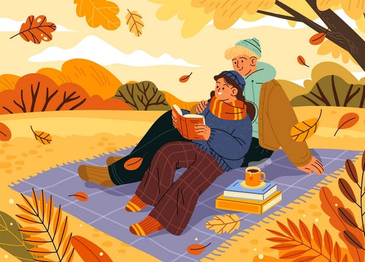Illustration eines Paares, das gemeinsam auf einer Herbstpicknickdecke liest