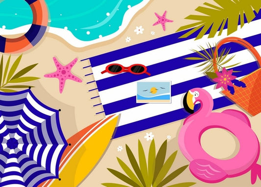 Top-down beach flat-lay with striped towel, sunglasses, starfish and pink flamingo float