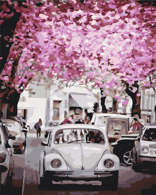 Paint-by-numbers canvas of a cherry blossom canopy over parked cars and a white vintage Beetle