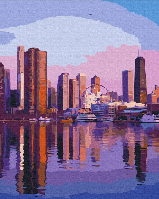 Chicago skyline glowing pink and purple at dusk, reflected in the lake with a Ferris wheel