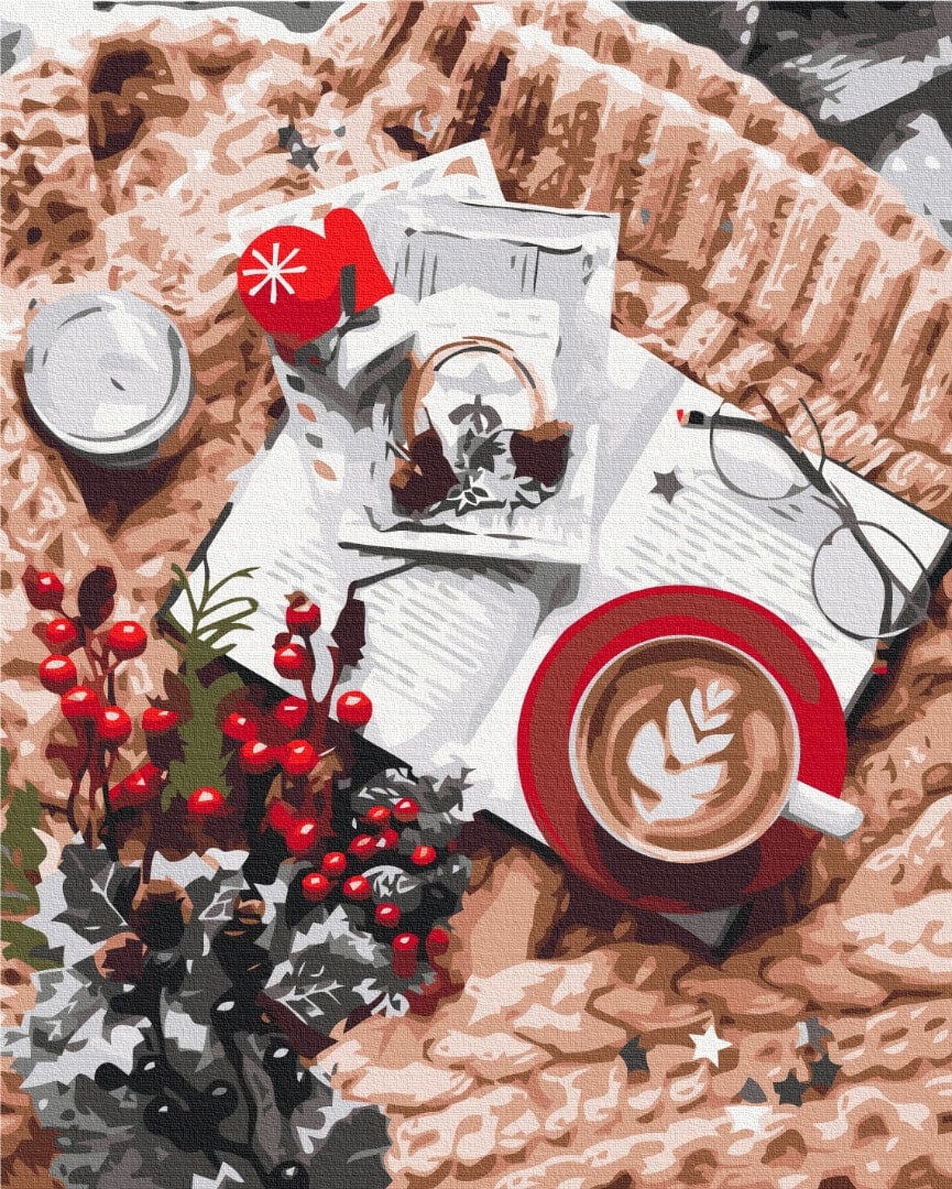 Draufsicht: Herz-Latte, Buch, roter Fäustling und Stechpalme auf einer Strickdecke