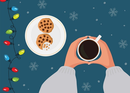 Top-down flat lay of coffee mug, chocolate chip cookies and colorful Christmas fairy lights on teal