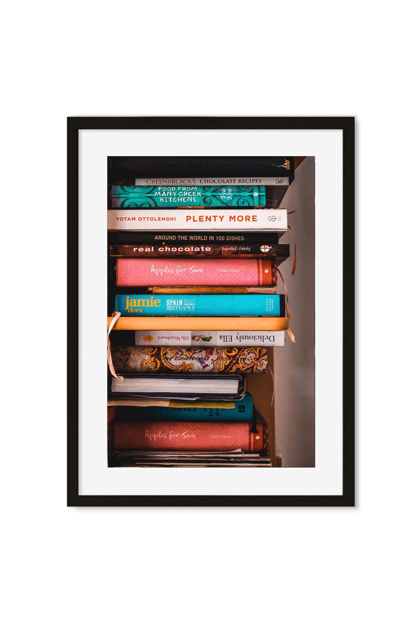 Photo poster of a colorful stack of cookbooks, including Ottolenghi's Plenty More, on a shelf