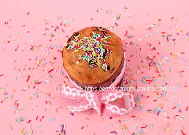 Easter bread topped with sprinkles and tied with a pink ribbon bow