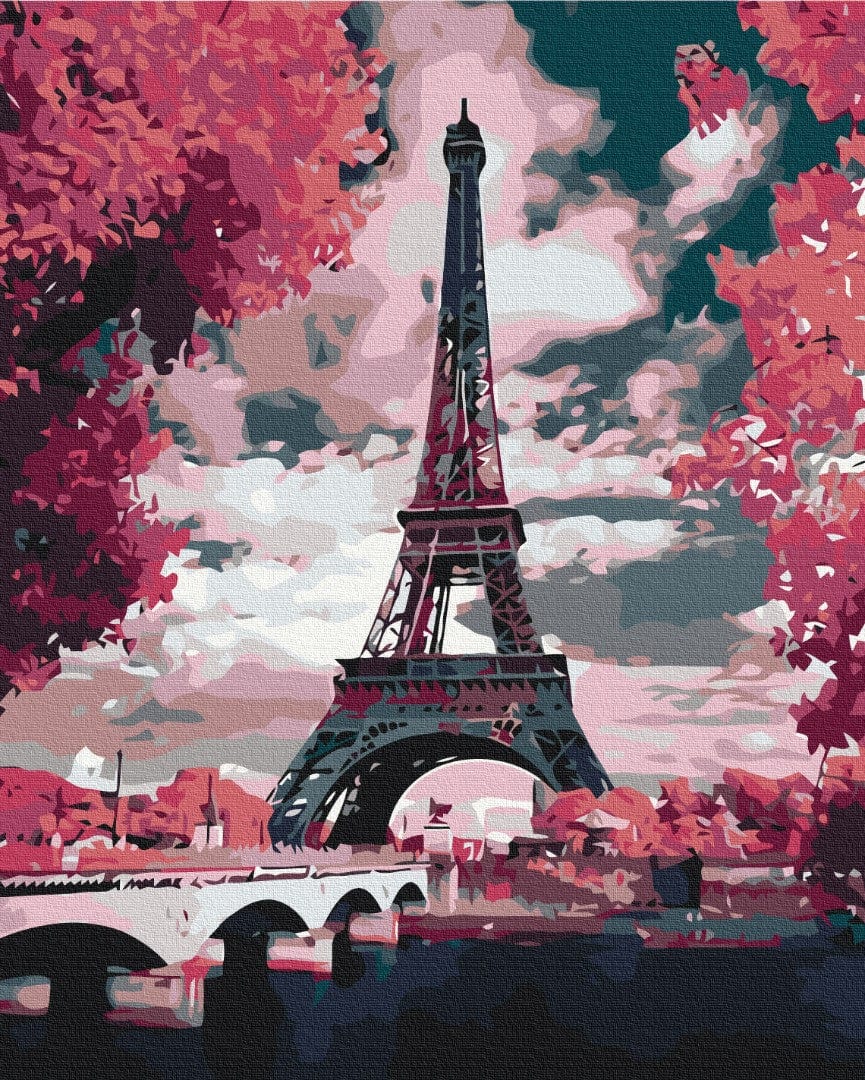 Paint-by-numbers canvas of the Eiffel Tower framed by pink blossoming trees under a dramatic sky
