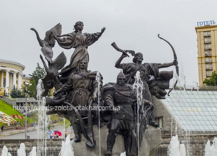 Bronze monument of Kyiv's legendary founders on a swan-prowed boat