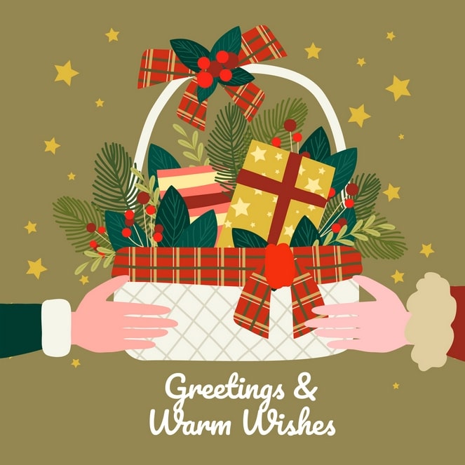 Hands offering a wicker gift basket with a red plaid bow, pine branches, and wrapped Christmas presents