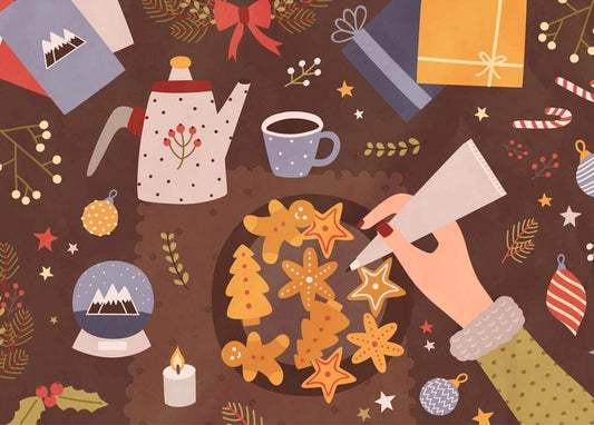 Hand piping icing onto gingerbread star and gingerbread-man cookies amid a Christmas flat lay with teapot and gifts