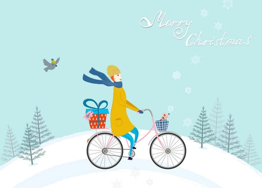 Girl in yellow coat cycling through snow with a gift and a bird, ‘Merry Christmas’ postcard scene