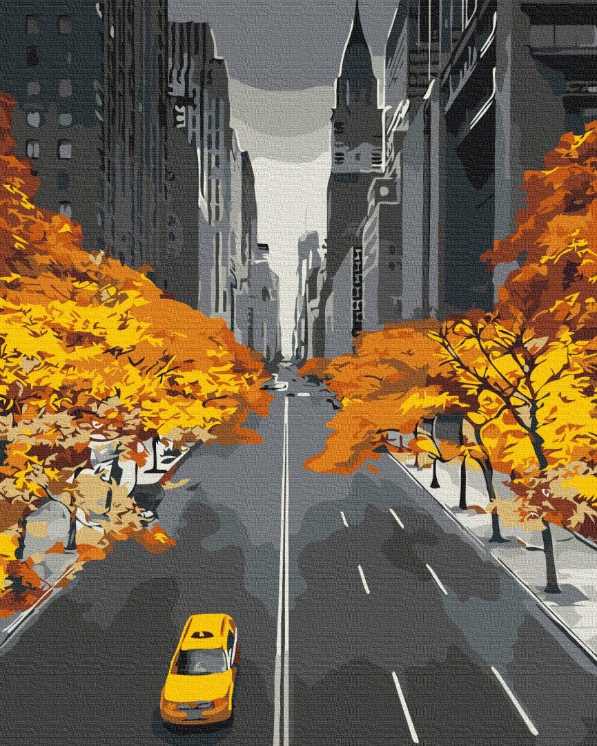 Yellow taxi driving down a New York avenue lined with golden autumn trees