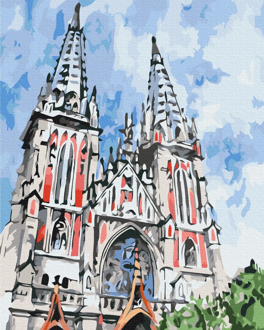 Gothic twin-spired church with rose-red stained glass windows against a blue sky