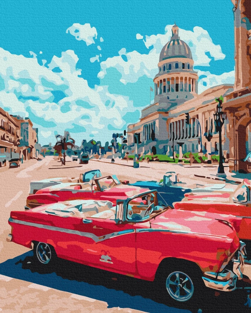 Cherry-red vintage convertible parked on a Havana street with El Capitolio's dome behind it