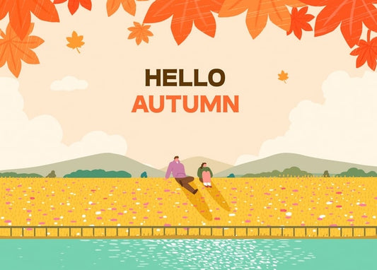 Schriftzug „Hallo Herbst“ mit einem Paar am goldenen Feld und See vor Bergen