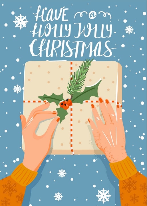 Hands wrapping a Christmas gift with a holly sprig, postcard reading ‘Have a Holly Jolly Christmas’