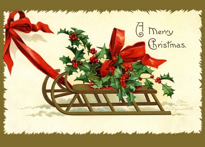Дерев'яні санчата з гостролистом і червоною стрічкою під написом A Merry Christmas
