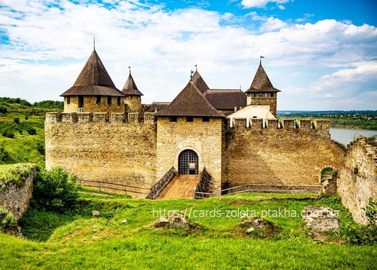 Khotyn Fortress with stone towers and wooden bridge above the Dniester River