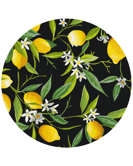 Round canvas with ripe lemons and white citrus blossoms on a black background