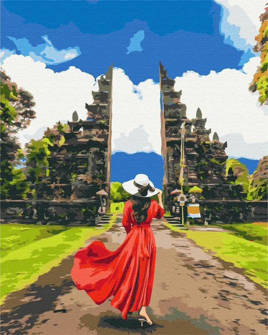 Paint-by-numbers scene of a woman in a red dress at the split gate of Pura Lempuyang, Bali