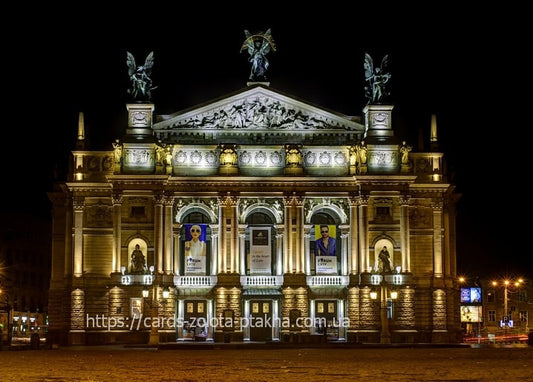 Lviv Opera House illuminated at night with rooftop statues against a dark sky