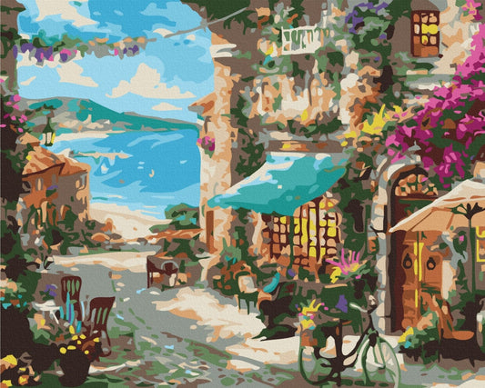 Paint-by-numbers scene of a Mediterranean alley with bougainvillea, a café awning and a bicycle overlooking the sea