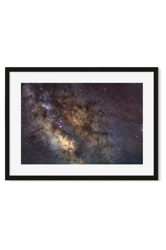 Close-up of the Milky Way's glowing core with dust clouds and stars across a dark night sky