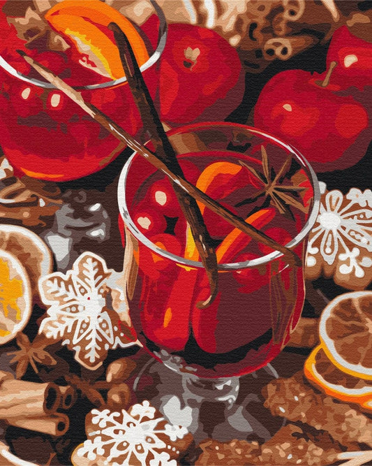 Zwei Gläser Glühwein mit Zimtstangen und Sternanis, umgeben von Äpfeln und Lebkuchen.