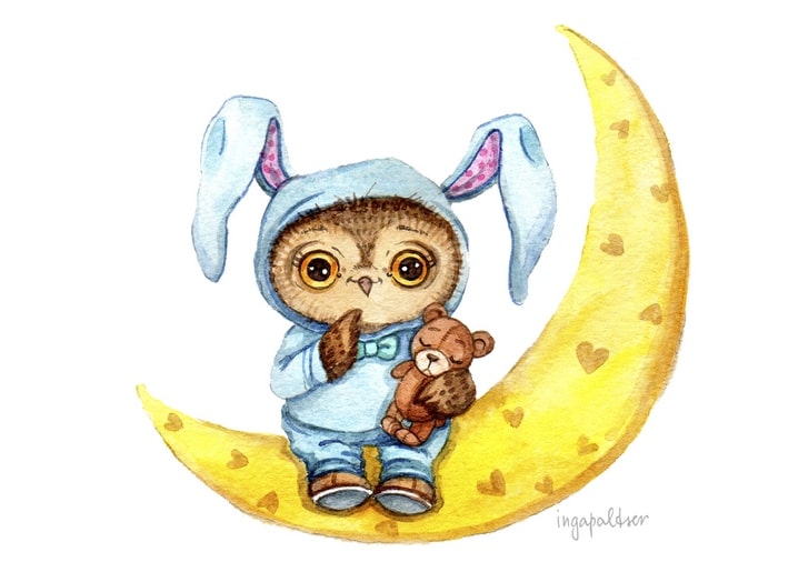 Baby owl in a blue bunny costume sits on a crescent moon hugging a small teddy bear.