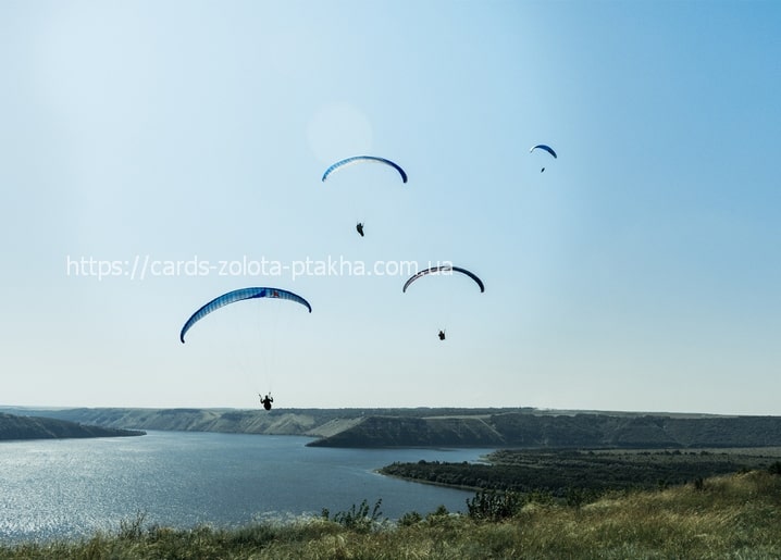 Paragliders flying above the Dniester Canyon near Bakota, Ukraine