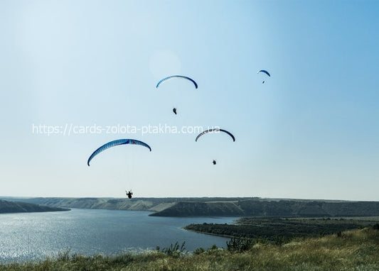 Paragliders flying above the Dniester Canyon near Bakota, Ukraine