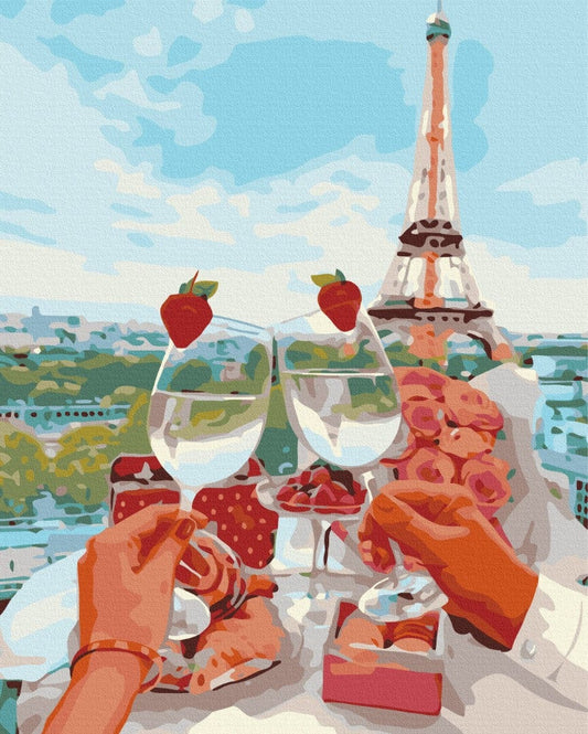 Couple toasting wine glasses on a Paris rooftop with the Eiffel Tower behind