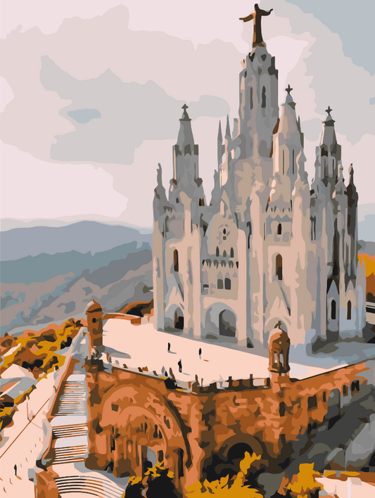 White Gothic spires of Sagrat Cor Church atop Tibidabo hill above Barcelona