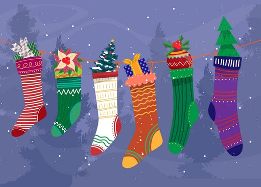Six patterned Christmas stockings hanging on a string against a dusk forest