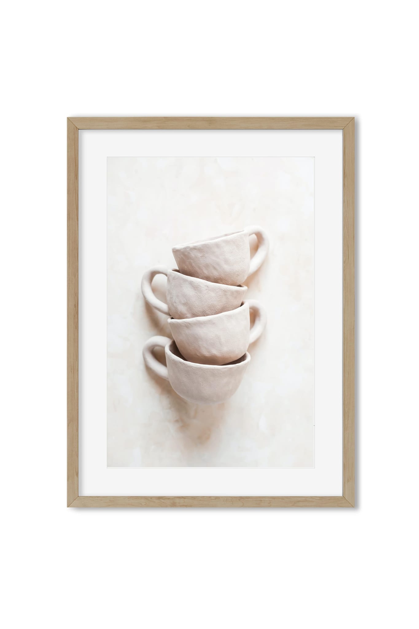 Four pale handmade-style ceramic cups stacked on a neutral background, poster