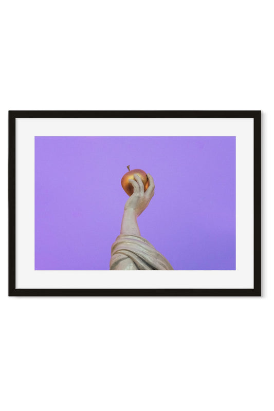 Classical statue's hand holding a golden apple against a bold violet background