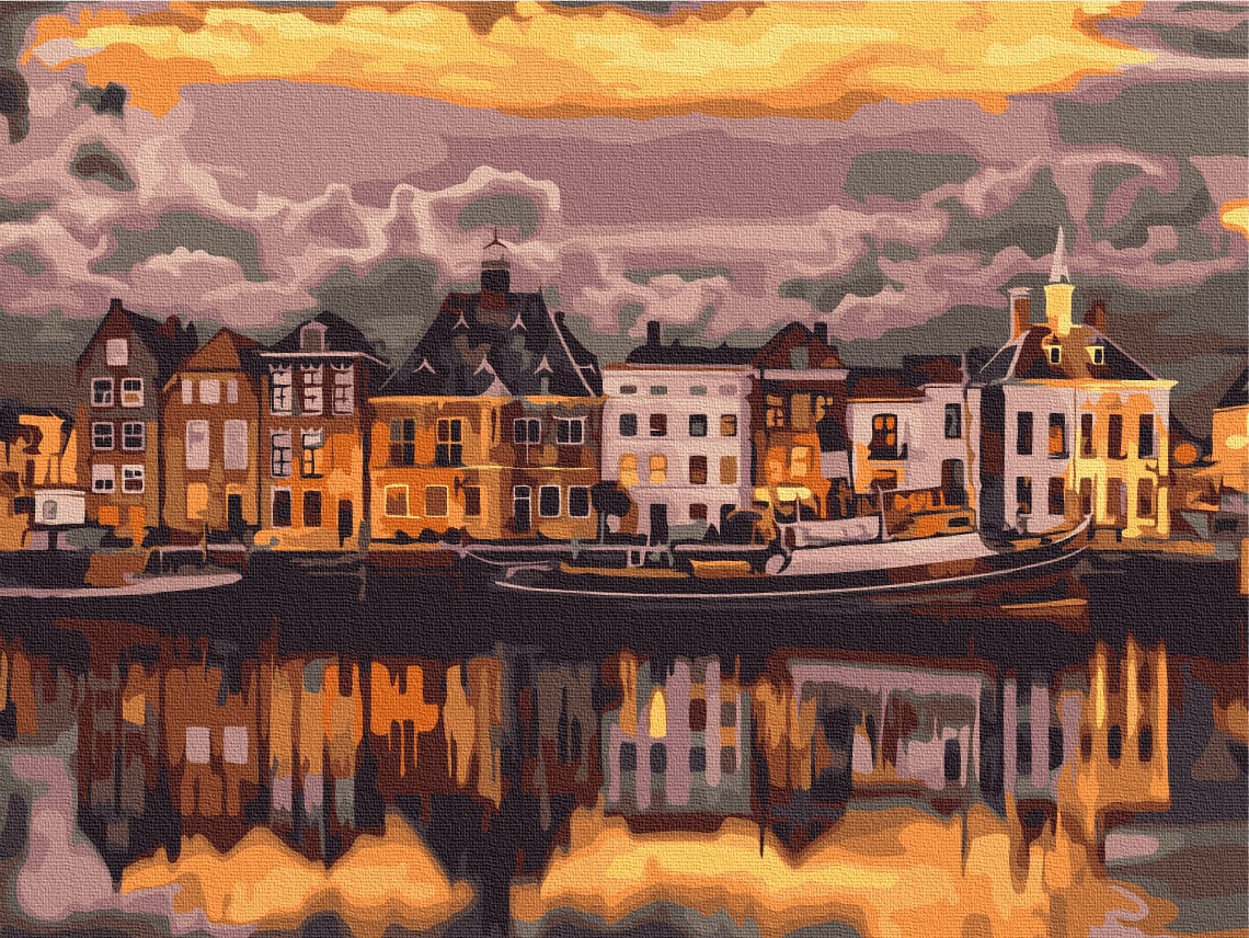 Row of gabled canal houses glowing at sunset, reflected in the water in Stockholm