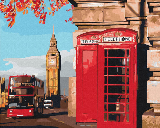 Two red telephone booths beneath Big Ben with an autumn branch and a London double-decker bus