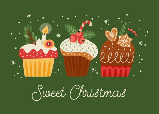 Three Christmas cupcakes with a candle, candy cane and gingerbread stars on green