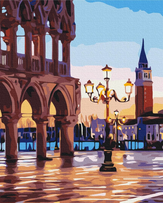 Doge's Palace arcade and bell tower in Venice glowing in golden evening light
