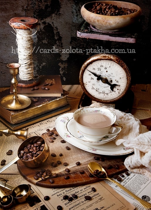 Vintage still life with a floral teacup, antique scale-clock, coffee beans and old books