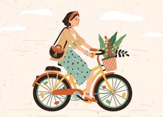 A woman in a headband rides a vintage yellow bicycle with flowers spilling from the front basket.