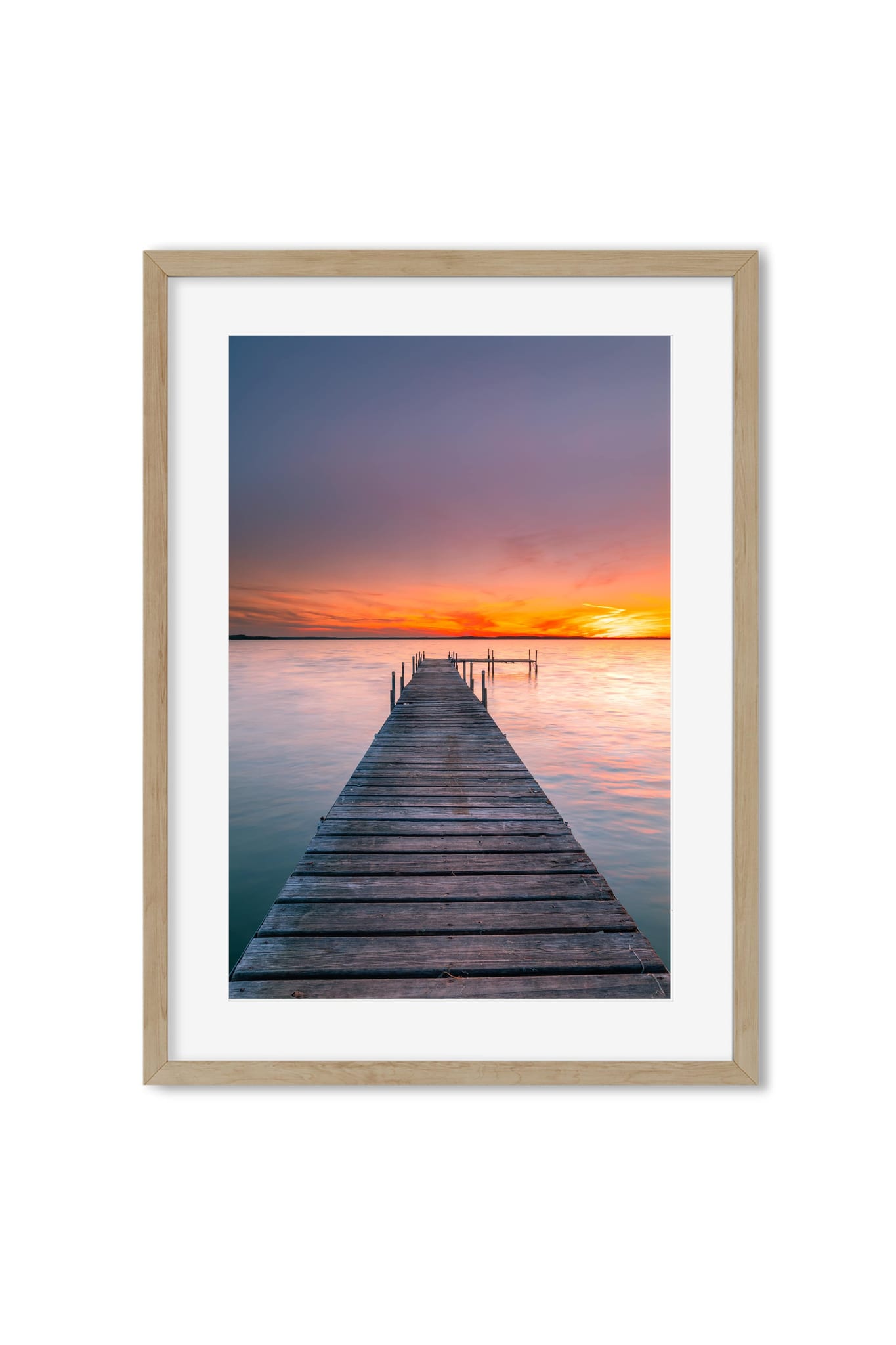 Photography poster of a wooden pier reaching into the water under an orange sunset